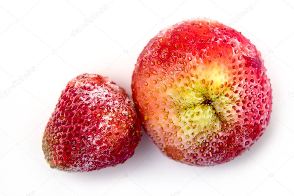 Frozen strawberries on a white background close-up