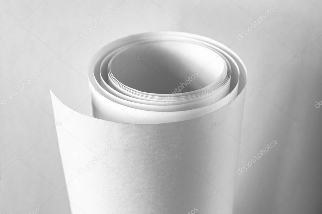 A roll of white paper. Black and white image.