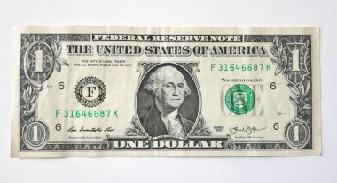 Beyaz arka plan yakın çekim üzerinde bir dolar ayırmak