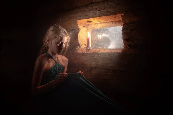 girl by the window in a wooden house with dim light