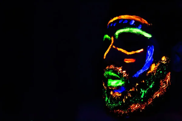 Man with neon makeup for a Neon Party