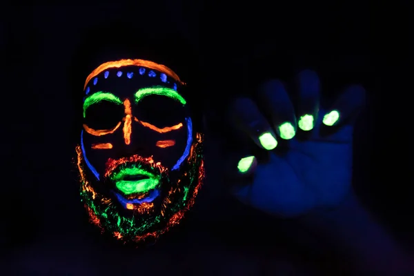 Man with neon makeup for a Neon Party