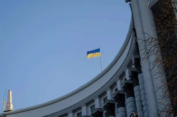 Ukrainian flag flying on the cabinet building