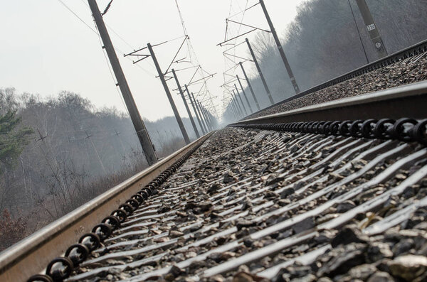 Railroad track on foggy morning