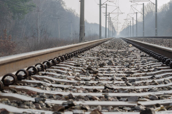 Railroad track on foggy morning