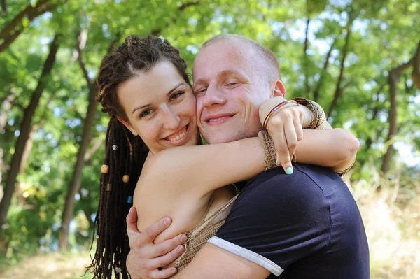 Smiling couple, woman embracing man — Stock Photo, Image