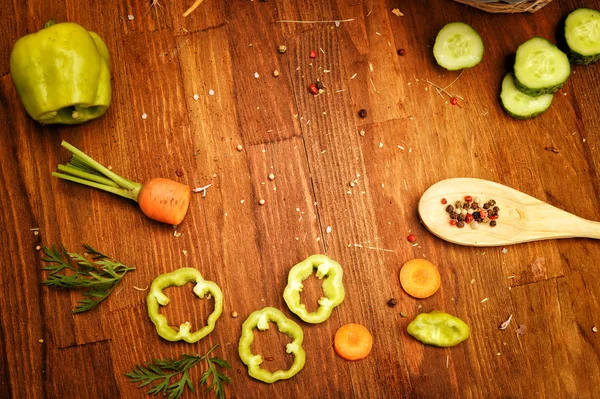 Assorted raw sliced vegetables and spices on a vintage style table, flat lay top view — Stock Photo, Image