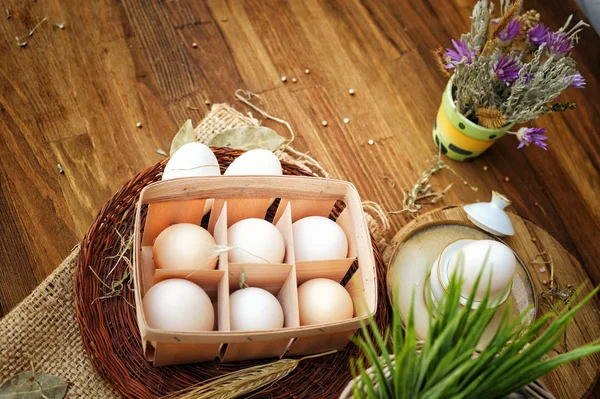 Fresh eggs on a wooden rustic background — Stock Photo, Image