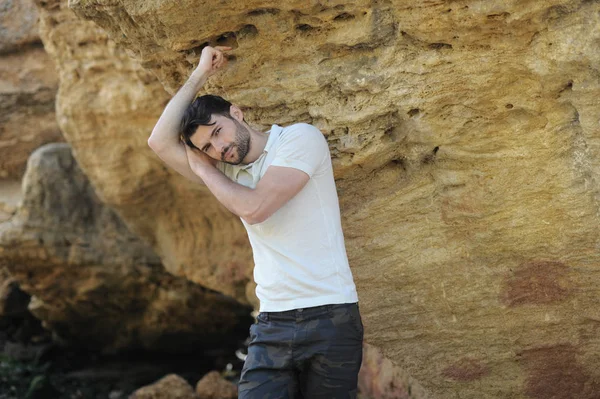 Handsome calm man outdoor portrait near rocks — Stock Photo, Image