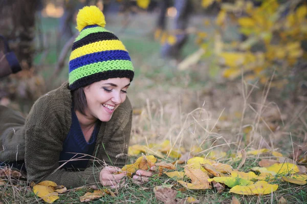 Young smiling woman portrait dressed in beanie hat with pom pom — Stock Photo, Image