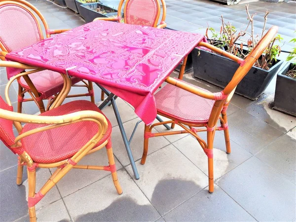 table in an outdoor cafe after the rain