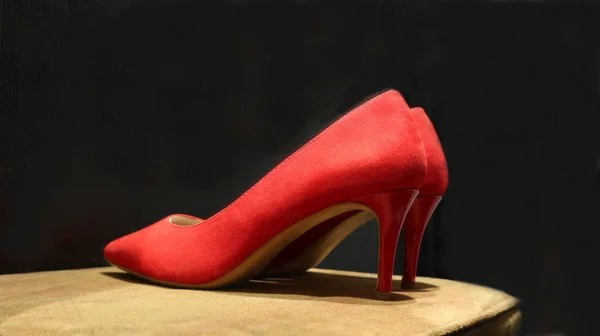 Pointed female shoes with  heels isolated on a black background.