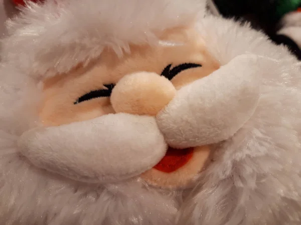 Close up. Santa Claus\'s face - plush doll