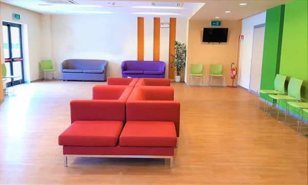 waiting room in a hospital with colorful furniture