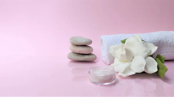 Spa setting and Spa background composition with white gardenia flower on pink background. Banne