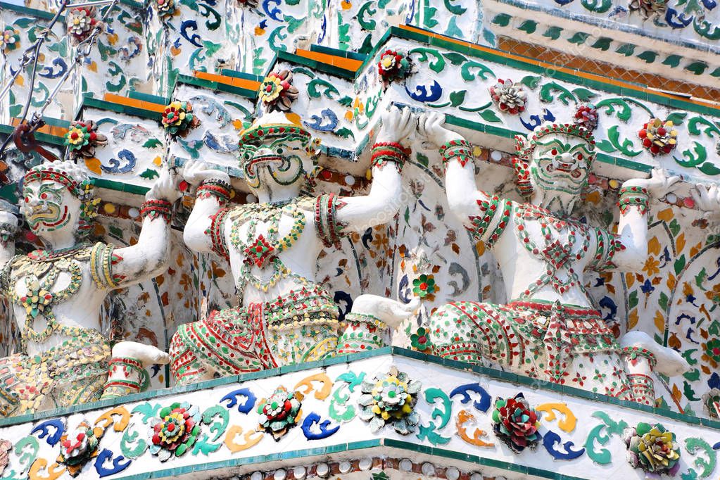 Close up of the intricate design & figures decorating Wat Arun, or the Temple of Dawn, Bangkok, Thailand.