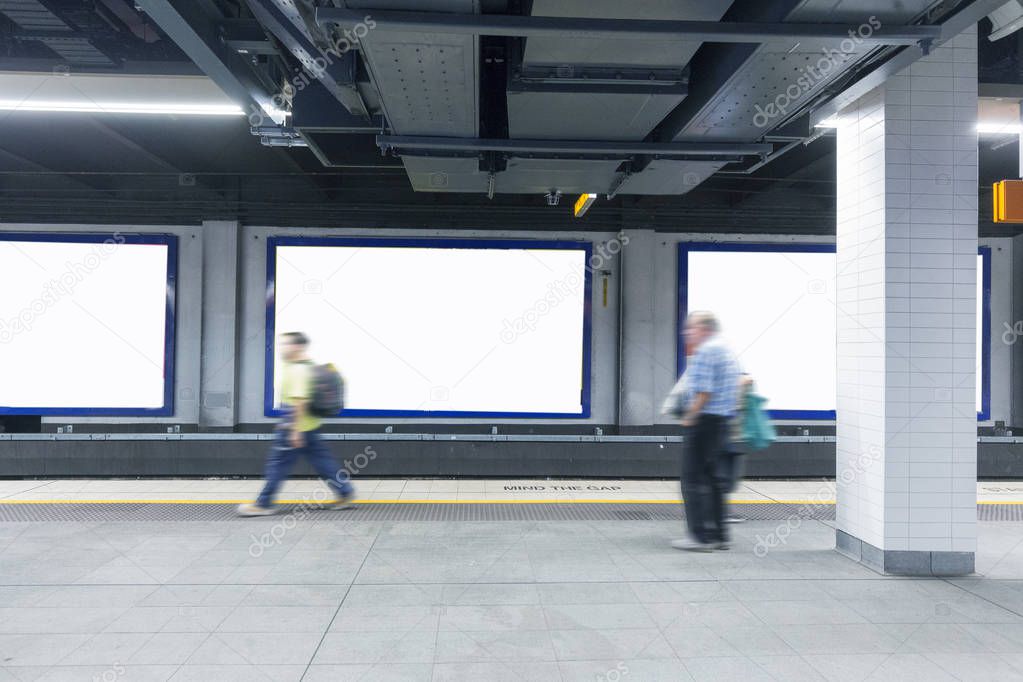 Sydney subway platform with blank billboard