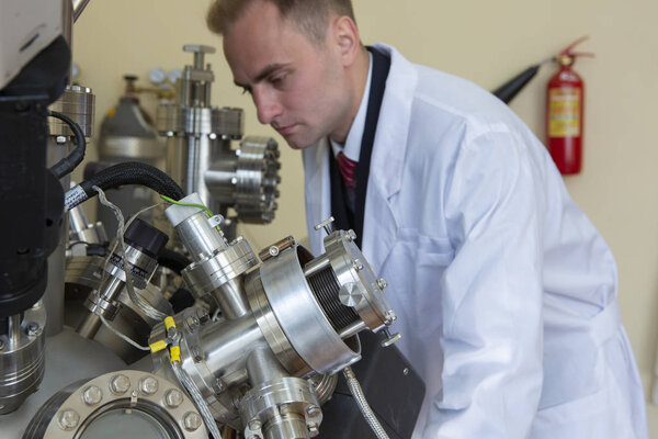 laboratory specialist examines the data obtained on a special apparatus for analyzing samples Close-up portrait