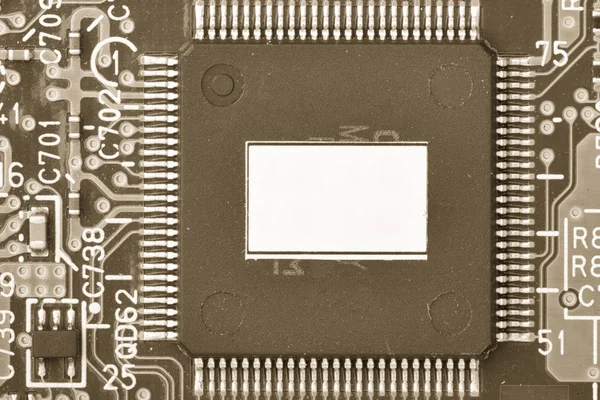 Printed circuit board close up for background Microchips and other components Small depth of field Toned image