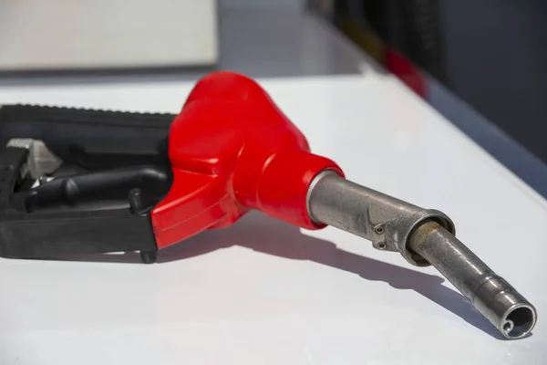 Gasoline pistol pump fuel nozzle Gas station pump. Man refueling gasoline with fuel in a car, holding a nozzle. Limited depth of field. — Stock Photo, Image