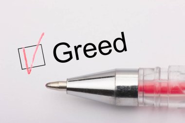 Açgözlülük - kalem ile beyaz kağıt üzerinde bir haç ile onay kutusu. Denetim listesi kavramı.