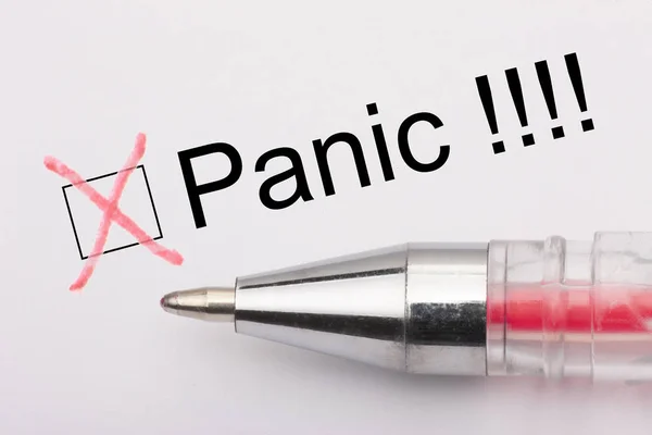 Panic - checkbox with a cross on white paper with pen. Checklist concept.