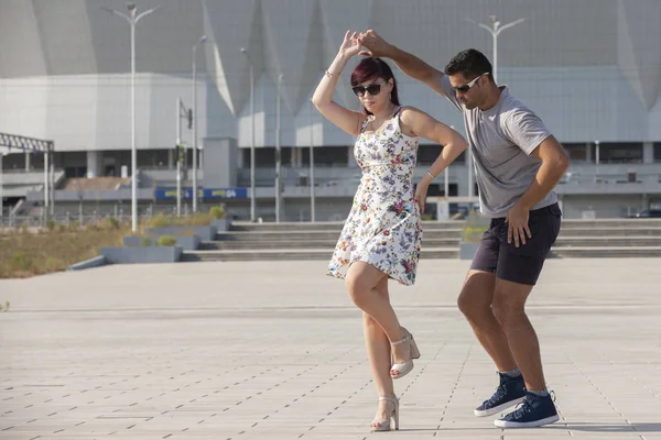 Young couple dances Caribbean Salsa. Social activity concept.