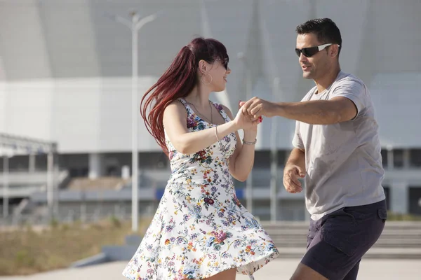 Young couple dances Caribbean Salsa. Social activity concept.