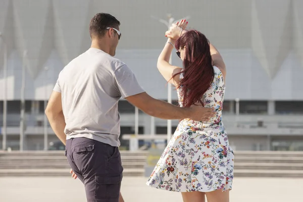 Young couple dances Caribbean Salsa. Social activity concept.