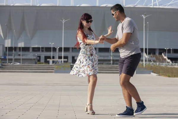 Street couple dancers performing Argentine tango dance