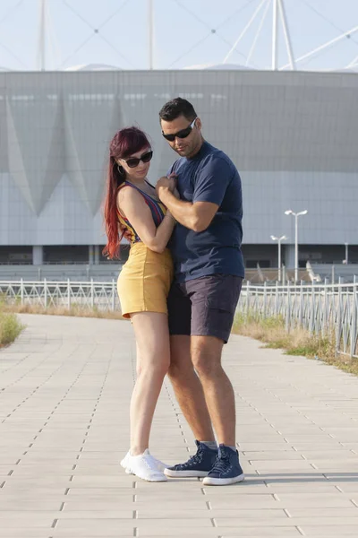 Couple dancing at sunset salsa brazilian zouk. Lovers, dance partners spinning, latin festival dance concept.