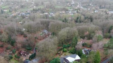 Countryside wealthy area in Wallonia, Belgium. Luxury villas with garden surrounded by forest during winter season