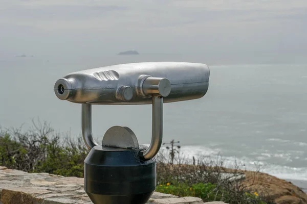 Paid binocular telescope on the tip of the Point Loma Peninsula in San Diego, California, USA. Close image of automated binoculars to observe San Diego city & bay. coin operated binoculars.