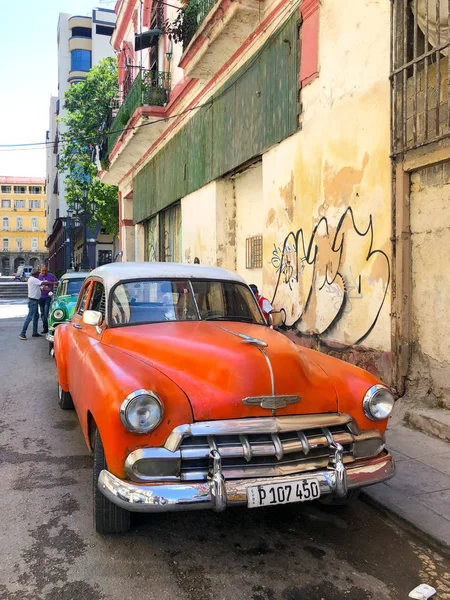 Red classic Cuban vintage car. American classic car on the road in Havana, Cuba.Famous car used for sightseeing and taxi in Havana.