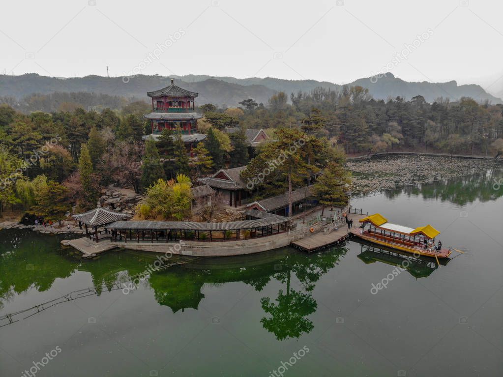 Aerial view little pavilions next the lake inside the Imperial Summer Palace of The Mountain Resort in Chengde. China. Chinese ancient building with lake and old style boat. UNESCO World Heritage.