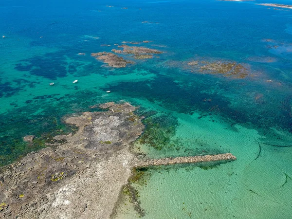 Aerial view of wonderful turquoise water with some rocks.  South coast of Guernsey island, UK, Europe.