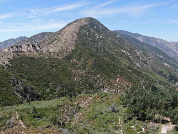 Aerial view of  Angeles National Forests mountain, California, USA. Green mountain during hot summer season