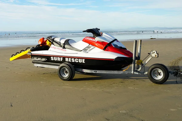 Lifeguard surf rescue jet-ski on the beach in La Jolla, San Diego, California. USA. Surf Rescue Jet Ski next to sea in order to keep swimmers and surfers safe.
