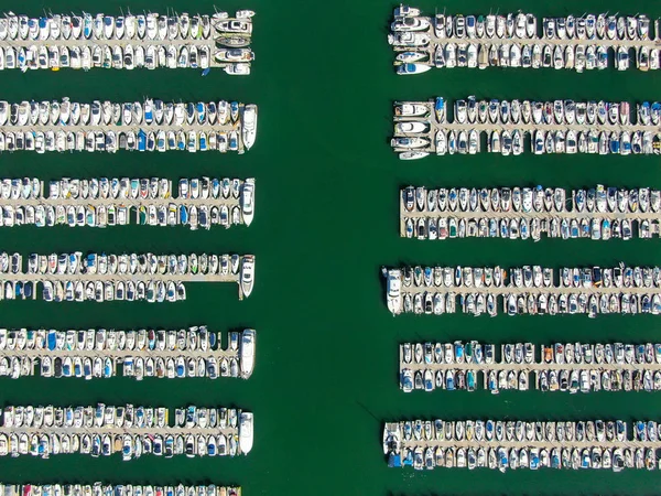 Aerial top view of boats and yachts in marina.