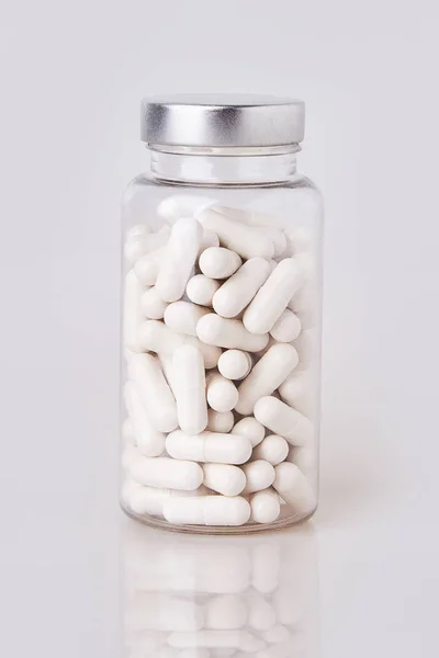 White Soft Gelatin Capsules Transparent Glass Bottle Isolated White Background — Stockfoto