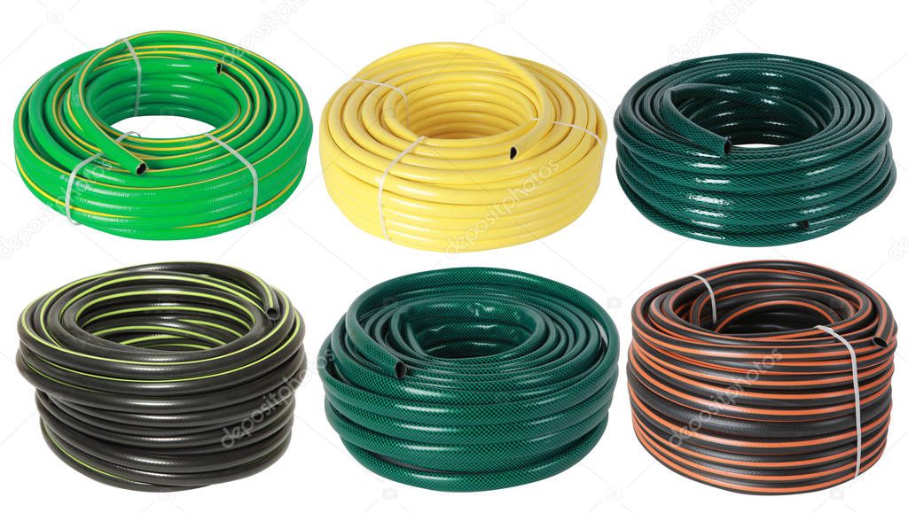 Set of curled plastic  garden water hoses (pipes) isolated on white