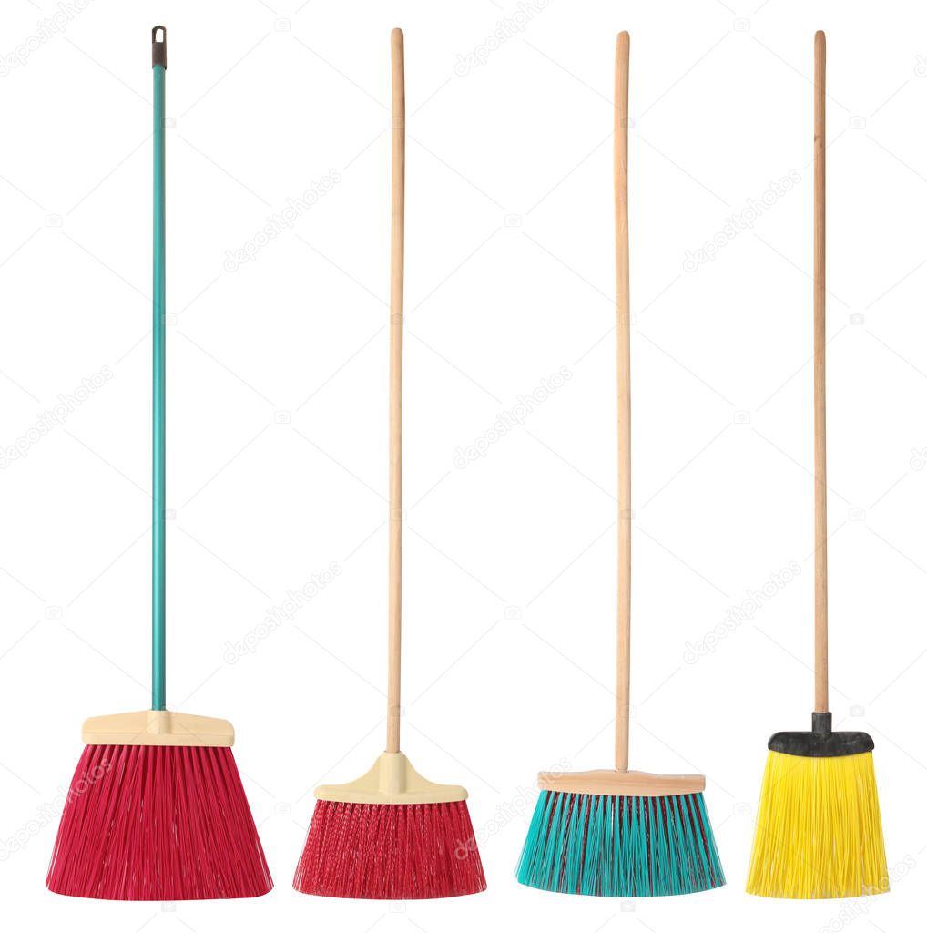 Set of colorful brooms  isolated on a white background. Cleaning the house topic