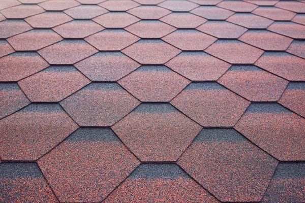 Soft roof, roof tiles. Flexible shingles. Roof tiling texture. Flexible, soft, bituminous, composite