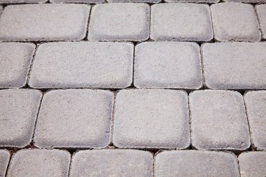 Kaldırım arka plan gri. Kaldırım doku. Perspektif görünümü monoton gri tuğla taş yere sokak yol için. Kaldırım, Driveway, döşeme, kaldırım. Kare desen 