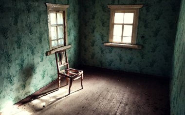 Interior of an abandoned room with bright daylight through windows. clipart