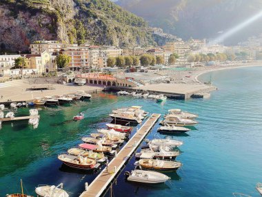 Port in Maiori, Italy. Amalfi Coast. View of city, beach and mountains clipart