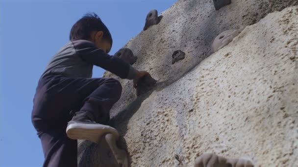Slow Motion Little Boy Climbing Playground Low Angle — Stock video