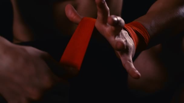 Male Boxer Wraps His Hands Red Hand Wrap Fight Training — Stock Video