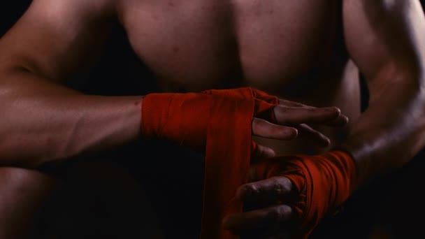 Male Boxer Wraps His Hands Red Hand Wrap Fight Training — Stock Video