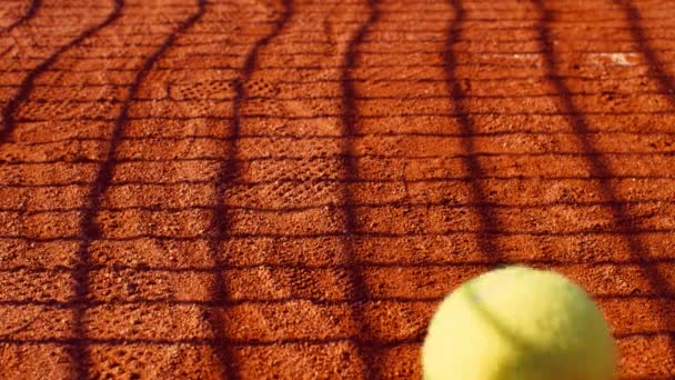 Rolling Tennis Ball Clay Tennis Court Slow Motion 75Fps — Stock Video